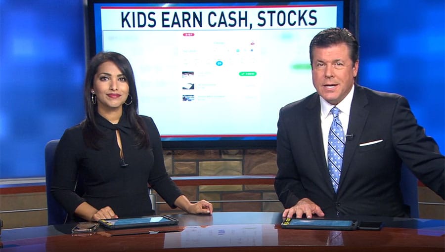 Two people sitting at a news desk with the words KEYE, Austin.