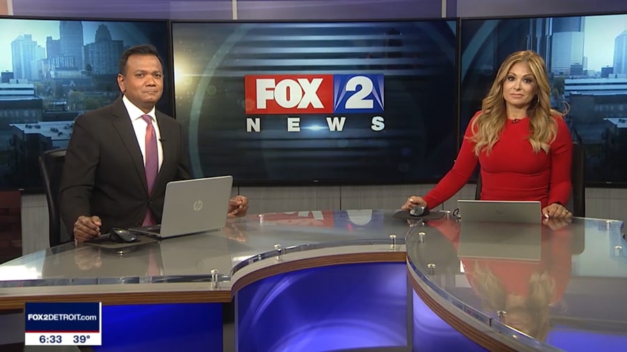 A man and woman on a fox news set.