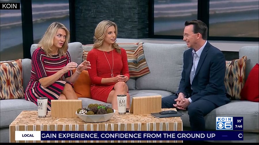 Three people are sitting on a couch talking on a TV show in Portland.