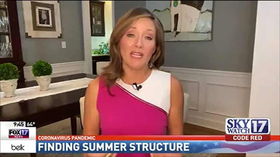 A news anchor is talking about finding summer structure.