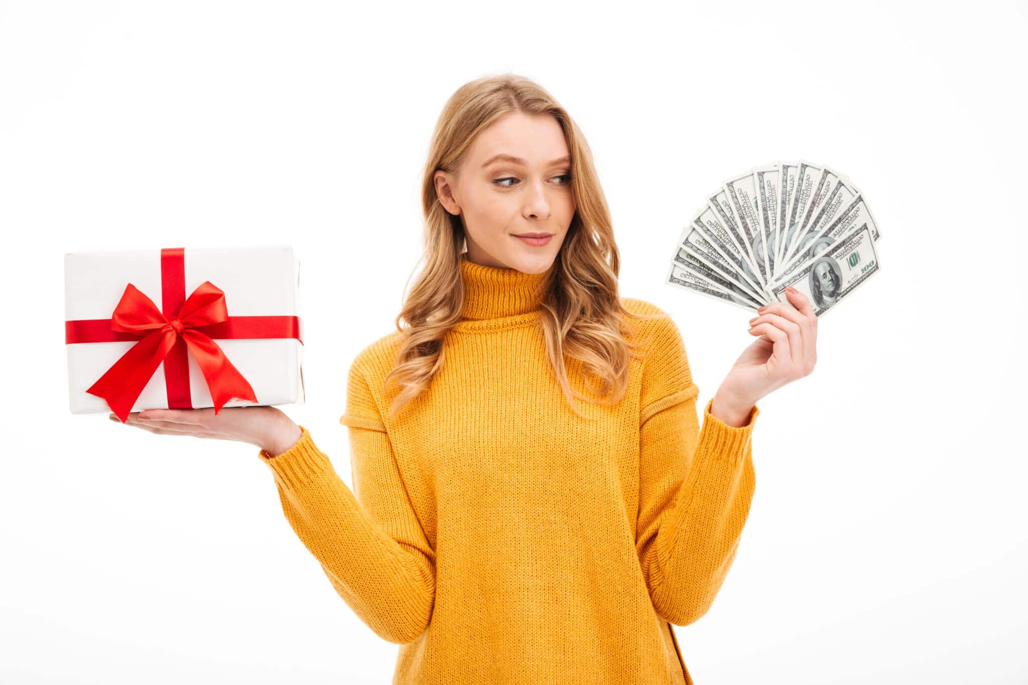 A woman holding money and a gift box, showcasing creative ideas for gifting cash on a white background.